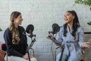 Two girls with microphones